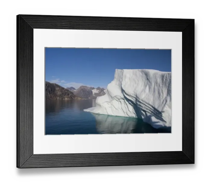 Framed Print : Greenland, Southeast coast, Skjoldungen Fjord. Large iceberg in scenic fjord surrounded Framed Print : Greenland, Southeast coast, Skjoldungen Fjord. Large iceberg in scenic fjord surrounded