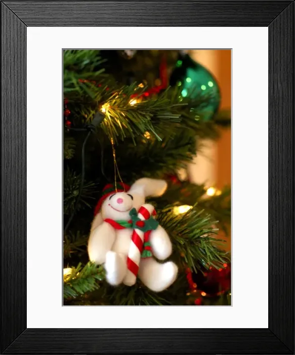 Framed Print : Holiday still life. Christmas tree with stuffed rabbit ornament. Property released Framed Print : Holiday still life. Christmas tree with stuffed rabbit ornament. Property released