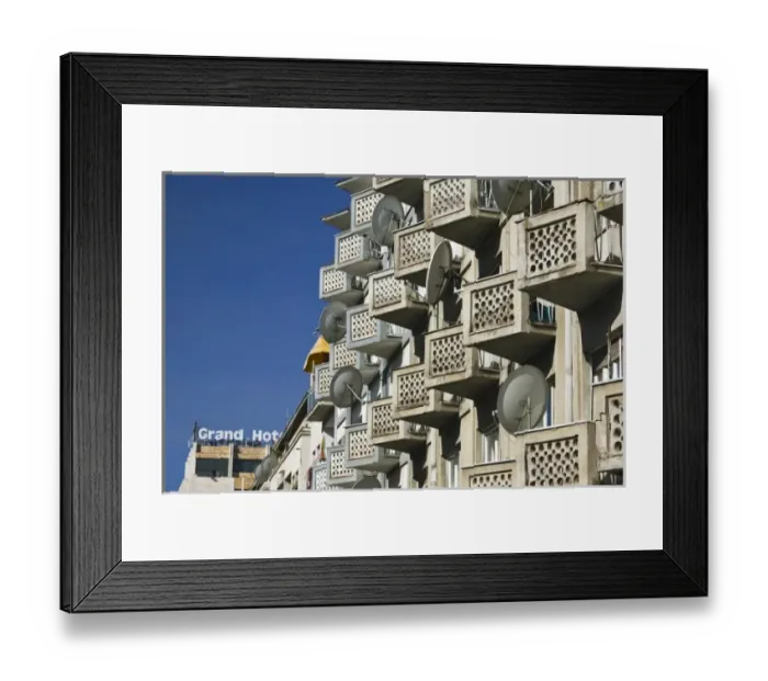 Framed Print : KOSOVO, Prishtina. Satellite dishes on apartment house