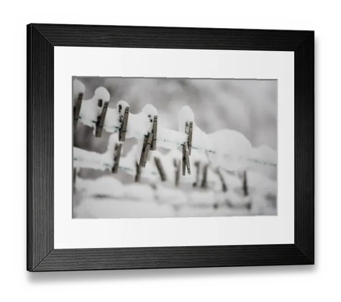 Framed Print : Snow on clothes pins on a clothes line Framed Print : Snow on clothes pins on a clothes line