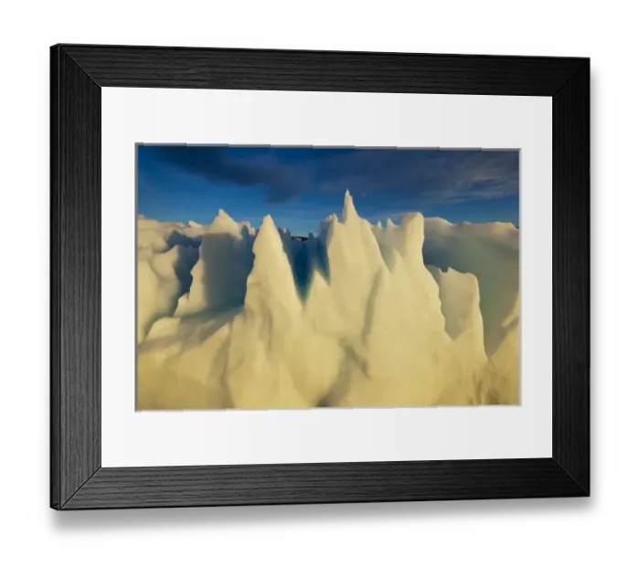 Framed Print : Greenland, Ilulissat, Setting midnight sun lights jagged floating iceberg near Eqip