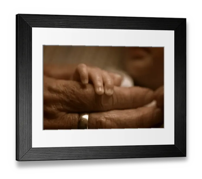 Framed Print : Studio close-up of young and old hands Framed Print : Studio close-up of young and old hands