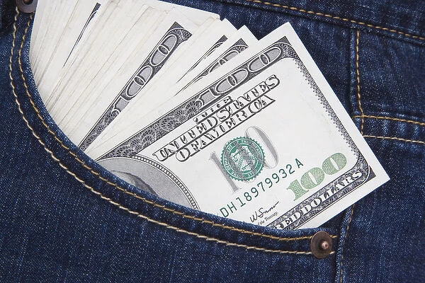 Some US $100 bills in a jeans pocket. Credit as: Dennis Flaherty  /  Jaynes Gallery  /  DanitaDelimont