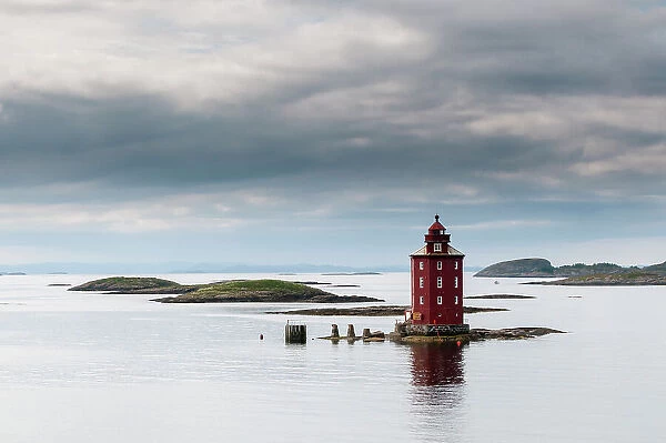 The 1880 Kjeungskjaer lighthouse sits on a small island in the glacial waters of Bjugnfjorden. Bjugnfjorden, Norway