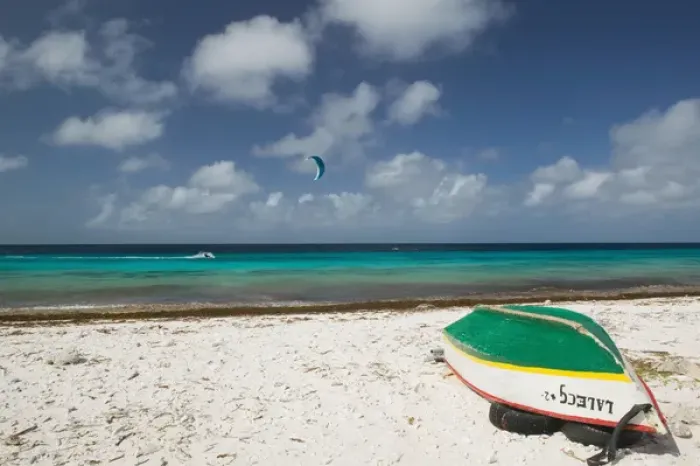 Framed Print : ABC Islands - BONAIRE - Pink Beach: Beach View with Fishing Boat & Kite Surfer Framed Print : ABC Islands - BONAIRE - Pink Beach: Beach View with Fishing Boat & Kite Surfer