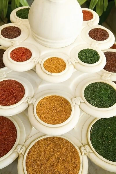 Abstract colorful bowls of spices in vases from above in Agra India