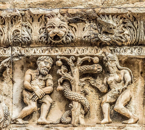 Adam and Eve facade, Nimes Cathedral, Gard, France. Created 1100 AD