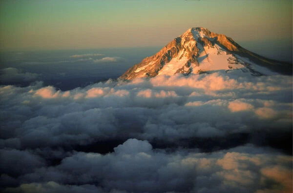 An aerial of Mt Hood, Oregon, peaking above the cloud cover