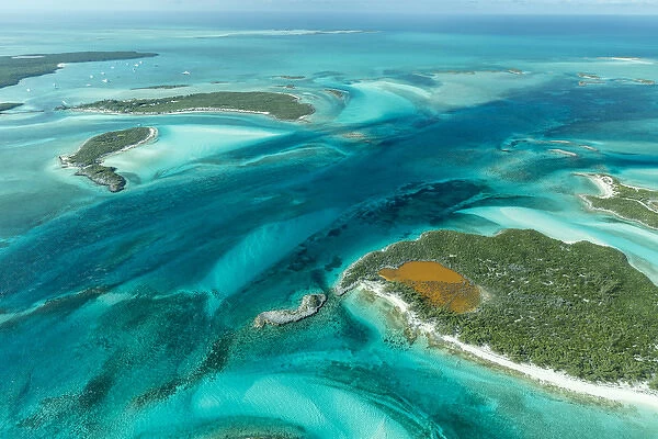 Aerial photo looking down at the clear tropical water and islands in the Exuma Chain