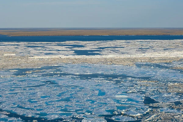aerial of spring breakup of ice along the Arctic coast, off the National Petroleum Reserves