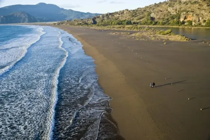 Framed Print : Aerial view of couple walking on beach in Dalyan, Koycegiz, Mugla, Turkey Framed Print : Aerial view of couple walking on beach in Dalyan, Koycegiz, Mugla, Turkey