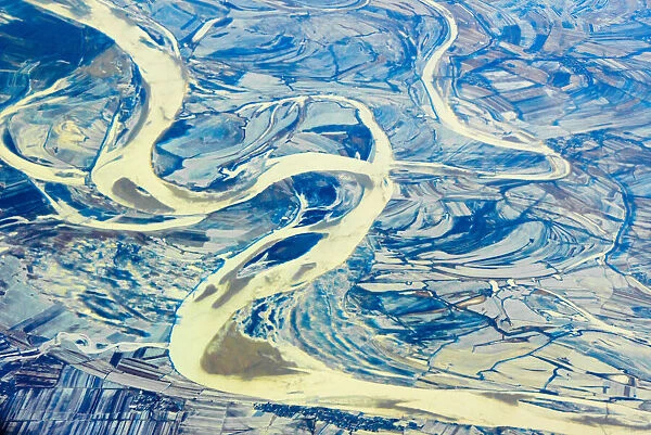 Aerial view of land and Songhua River covered by ice, northeast China