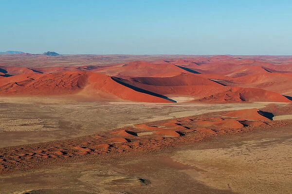 An aerial view of red sand dunes in the Namib desert. Namib Naukluft Park, Namibia