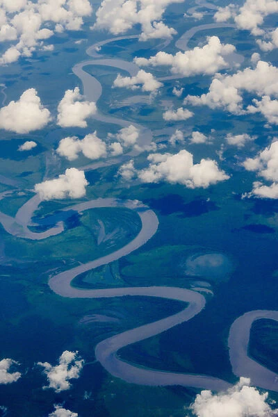 Aerial view of river winding through the island, Indonesia