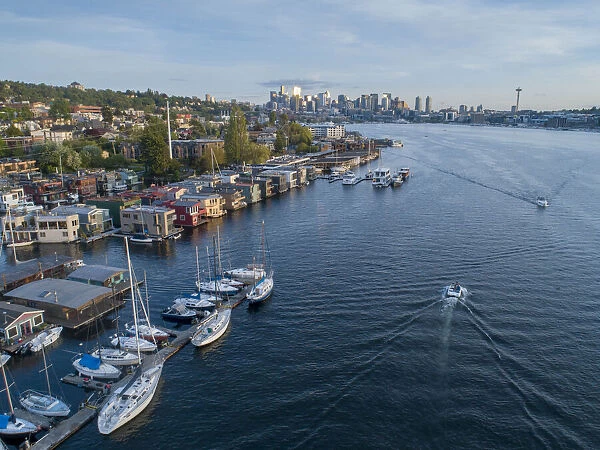 Aerial view of sailboats and houseboats on Lake Union with downtown Seattle in the