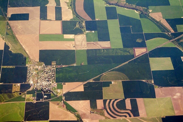 Aerial view of small town surrounded by patchwork quilt of agricultural fields in Willamette Valley