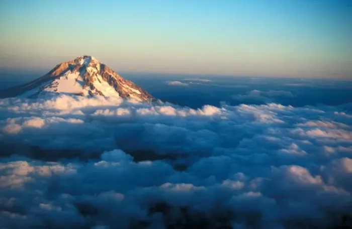 Framed Print : Aerial view of snow covered Mt. Hood poking through the clouds just at an Oregon sunset Framed Print : Aerial view of snow covered Mt. Hood poking through the clouds just at an Oregon sunset