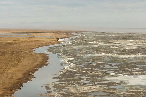 aerial view of spring ice breakup along the coast east of Point Barrow, National Petroleum Reserves