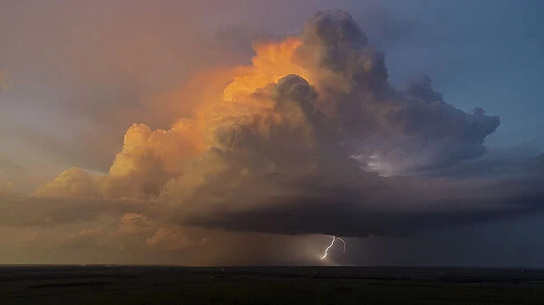 Aerial view of thunderstorm clouds and lightning at sunset, Marion County, Illinois
