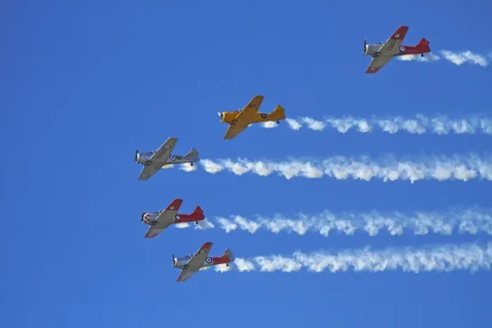 Framed Print : Aerobatic display by North American Harvards, or T-6 Texans, or SNJs