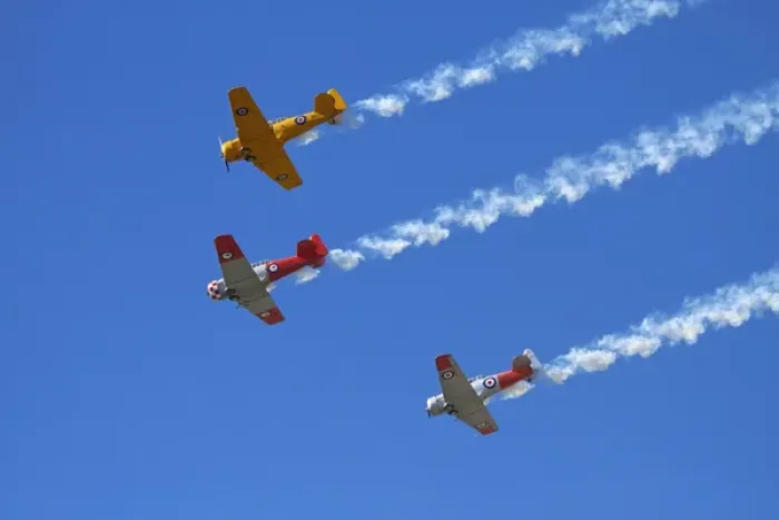 Framed Print : Aerobatic display by North American Harvards, or T-6 Texans, or SNJs Framed Print : Aerobatic display by North American Harvards, or T-6 Texans, or SNJs