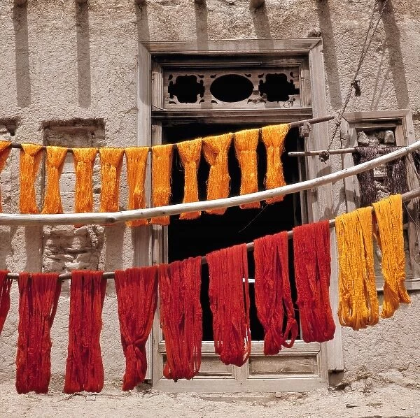 Afghanistan, Ghazni. Brightly-colored wool, recently dyed, is hung to dry in Ghazni, Afghanistan