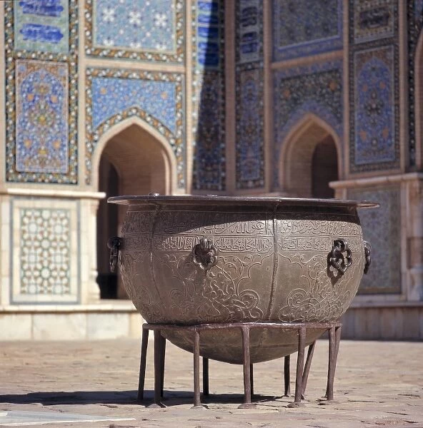 Afghanistan, Herat. An ancient brass cauldron rests in the inner courtyard at the