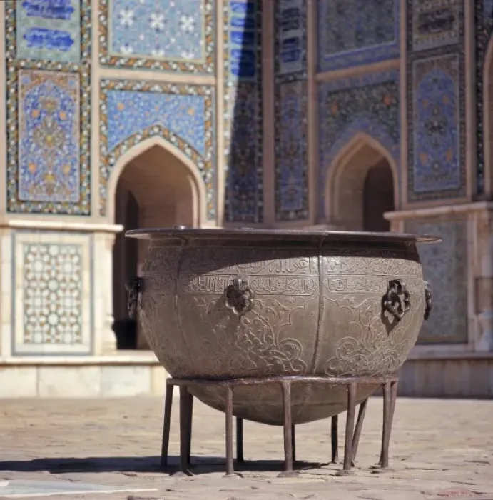 Framed Print : Afghanistan, Herat. An ancient brass cauldron rests in the inner courtyard