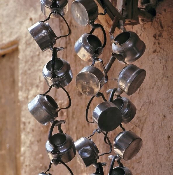 Afghanistan, Tashkurghan. Metal teapots create a necklace of silver at a tea stall