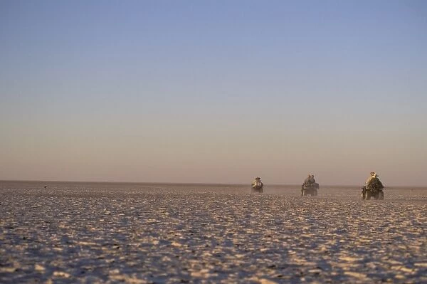 Africa, Botswana, Makgadikgadi Pans. ATVs in desert