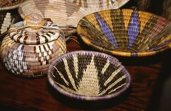 Africa, Botswana, Okavango Delta, Jao Reserve, Tubu Tree. Colorful camp staff made reed baskets