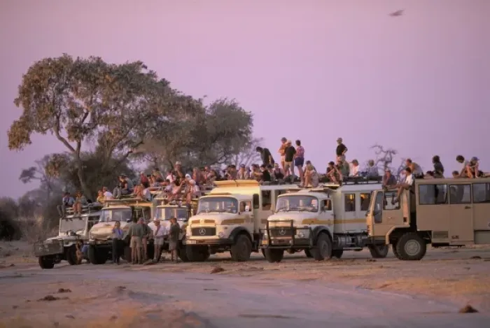 Framed Print : Africa, Botswana, Savuti. Overland vehicles at waterhole Framed Print : Africa, Botswana, Savuti. Overland vehicles at waterhole
