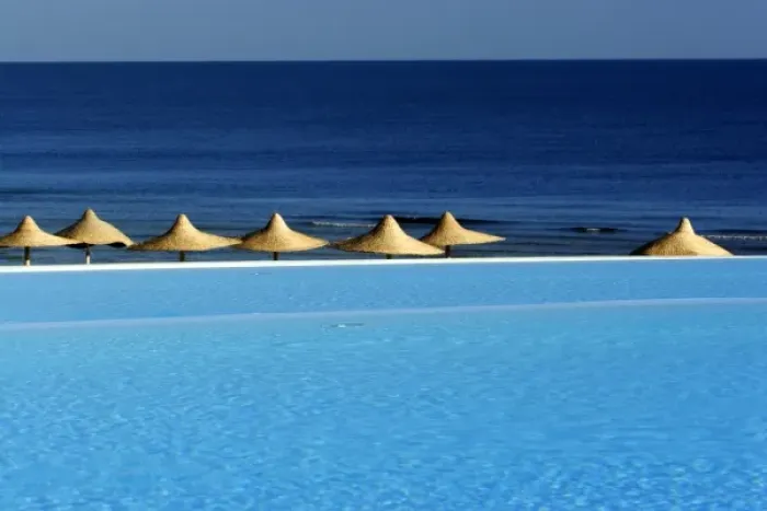 Framed Print : Africa, Egypt, Marsa Alam, Red Sea, beachside pool and umbrellas