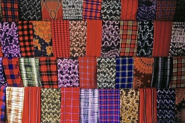 Africa, Kenya, Msai Mara. A colorful display of fabrics and cloth of the Msai