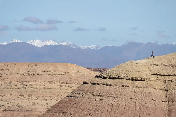 Africa, Morocco, Ait Benhaddou. Person atop barren hill