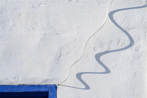 Africa, Morocco, Asilah. Wall shadow of wire