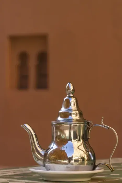 Framed Print : Africa, Morocco, Dades Gorge. Tea service reflects the colors of the steep walls
