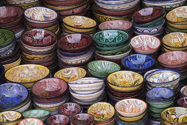 Africa, Morocco, Marrakech. Colorfully painted ceramic bowls for sale in a souk, a shop