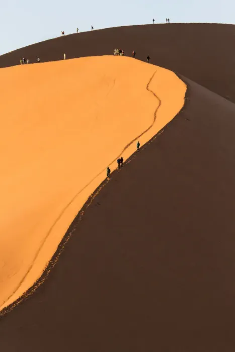 Framed Print : Africa, Namib Desert. Hikers climbing the red sand dune in Namibia Framed Print : Africa, Namib Desert. Hikers climbing the red sand dune in Namibia