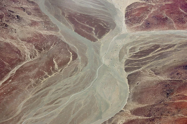 Africa, Namibia, Damaraland. Aerial view of dry river beds running through red rock