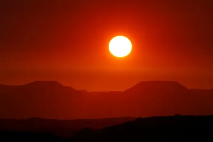 Framed Print : Africa, Namibia, Damaraland. After a scorching day the sun sets over the Table Mountains