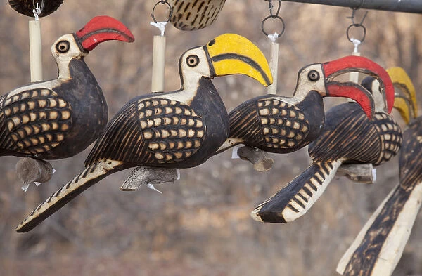 Africa, Namibia, Etosha National Park. Close-up of wooden bird carvings. Credit as
