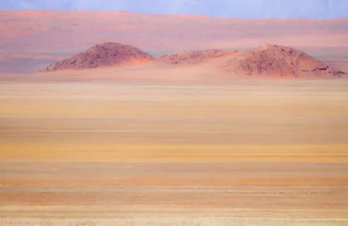 Framed Print : Africa, Namibia. Heat distorts grassy plain and red sand dunes Framed Print : Africa, Namibia. Heat distorts grassy plain and red sand dunes