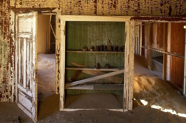 Africa, Namibia, Kolmanskop, Drifting sand fills building interior in abandoned diamond