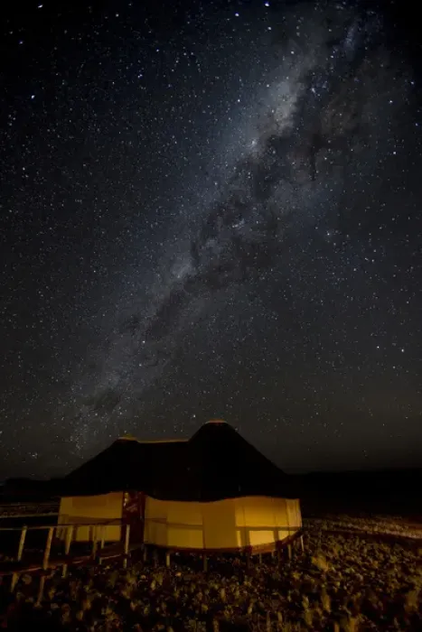 Framed Print : Africa, Namibia, Namib-Naukluft Park, Dune Lodge. Lodging hut and Milky Way. Credit as