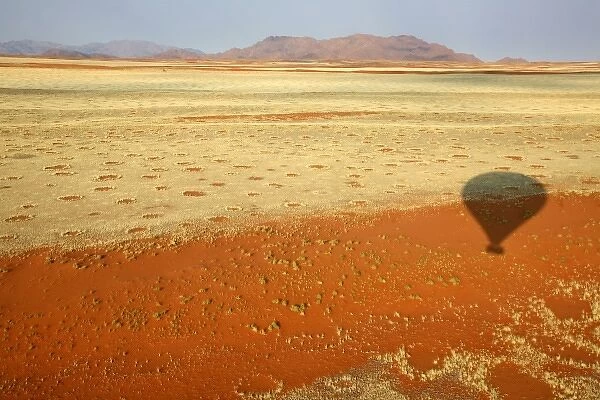 Africa, Namibia, Sossusvlei. Hot air ballooning over the red dunes, grasses