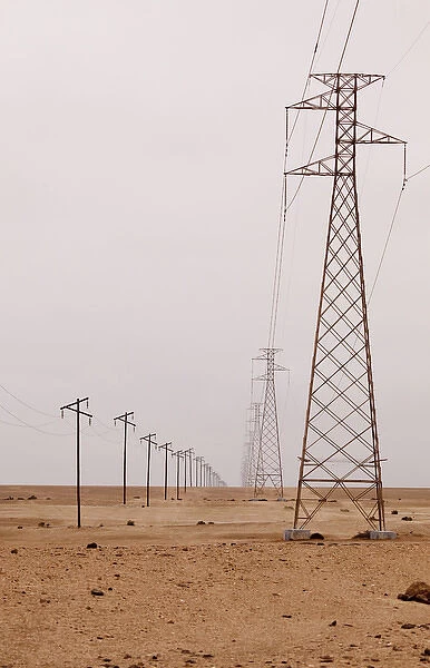 Africa, Namibia, Swakopmund. View of power and telephone lines in Namib Desert. Credit as