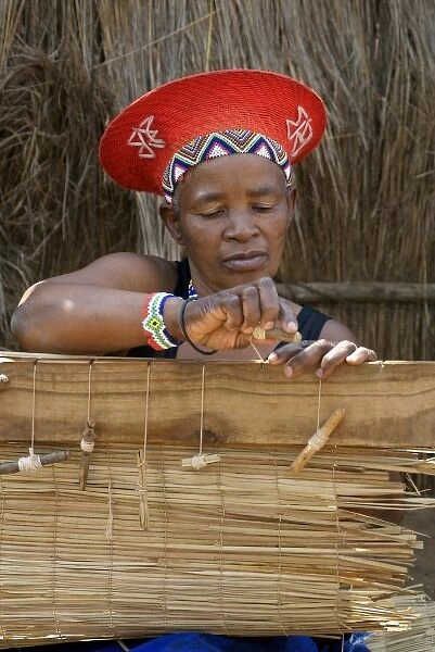 Africa, South Africa, KwaZulu Natal, Shakaland, Zulu woman weaving mats (MR)