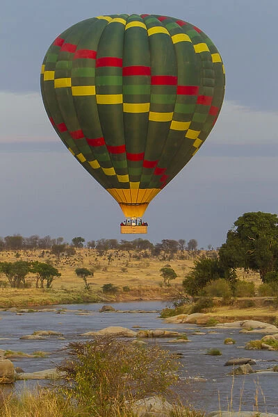 Africa. Tanzania. Hot air balloon crossing the Mara river in Serengeti NP