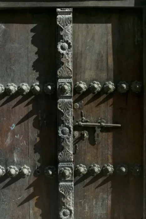 Framed Print : Africa, Tanzania, Zanzibar, Stone Town, Morning sun lights elaborately carved wooden